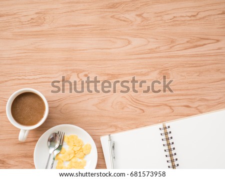 Flat Lay of coffee cup with conflex and office tools over old wooden background. The concept is wooden workspace with copy space background.