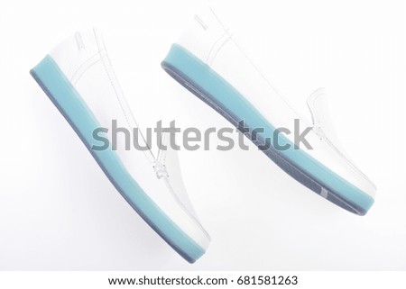  Pair of female leather shoes isolated on white background, top view. 