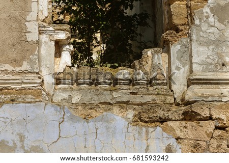 Mystical Interior, ruins of facade of an abandoned ruined building of an ancient castle, mansion. Old ruined walls, corridor with garbage and mud. Ruins Ancient historic building destroyed by vandals Royalty-Free Stock Photo #681593242