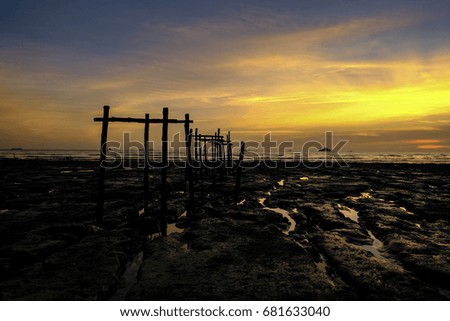 Twilight Sunset Old Wooden Jetty and Orange Sky Reflection