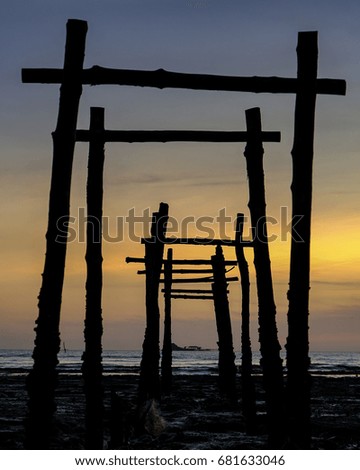 Twilight Sunset Old Wooden Jetty and Orange Sky Reflection