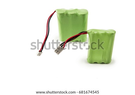 Battery covered with a green plastic isolated on white background