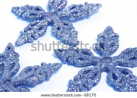 Snowflake Christmas decorations on a white background.  Digitally Enhanced.