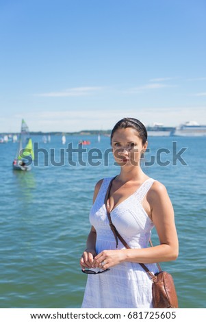 Beautiful woman on a sunny day
on the sea