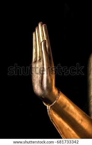 Gold hand on black