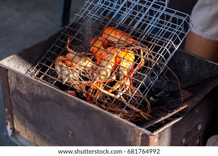 Grilled shrimps, prawns on the flaming grill