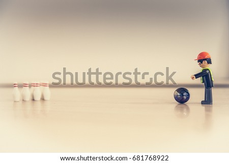 Finger bowling with children's toys