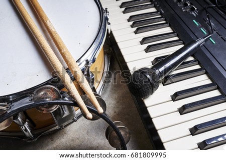 group of musical instruments including a drum and keyboard