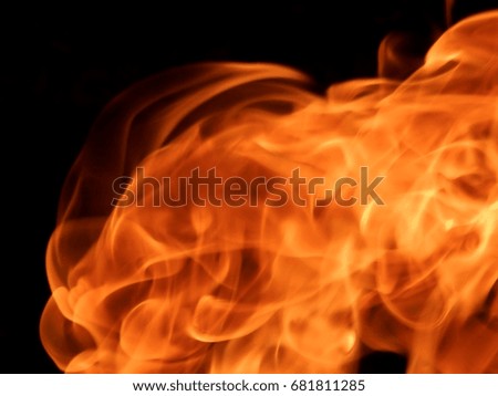 The texture of a fiery flame of fire on a black background