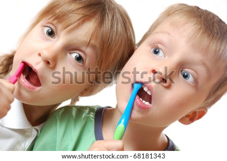 kids brushing their teeth over white background