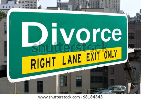 A green highway sign with the word Divorce in white letters.