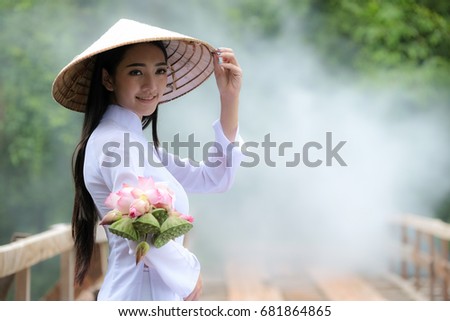 Beautiful woman portrait with Vietnam culture traditional dress,traditional costume ,vintage style,Vietnam