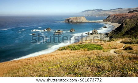 Panoramic view of the Pacific Coast from Goat Rock state park, Sonoma Coast, California, USA, from a high view point, on a sunny Summer day.  Royalty-Free Stock Photo #681873772