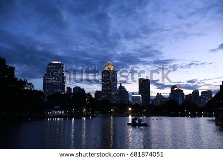 blur picture and out of focus: Bangkok: 2014: November, 06 : blue sky and tall building near river at sunset