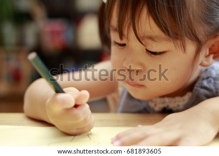 Japanese girl drawing a picture (2 year olds)