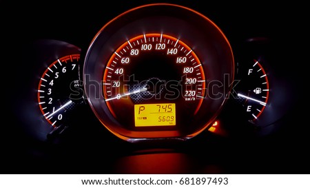 closed up car speed meter at night 
