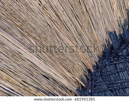hand made craft work broomstick small broom sweeper made of long dried brown tropical grass flowers for indoor use crop closeup detail