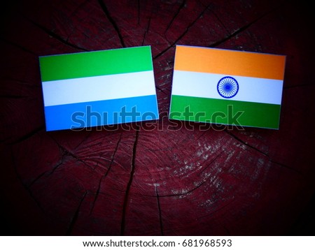 Sierra Leone flag with Indian flag on a tree stump isolated