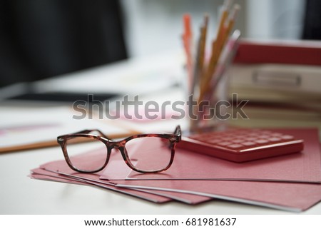 Close-up picture of red glasses.