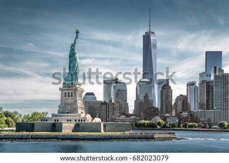The Statue of Liberty with One World Trade Center background, Landmarks of New York City, USA