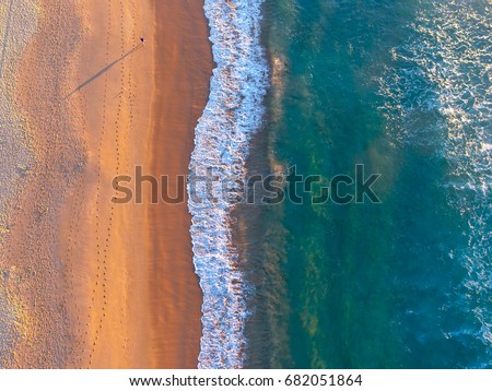 Sunrise Walk On The Beach Royalty-Free Stock Photo #682051864