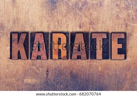 The word Karate concept and theme written in vintage wooden letterpress type on a grunge background.
