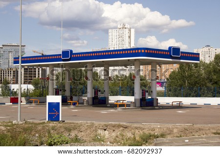 Gas station on blue sky background