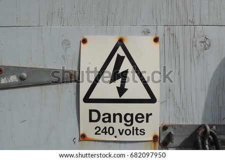 A sign at Portwrinkle in Cornwall - Danger 240 volts 