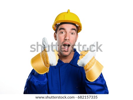 Happy worker with an okay gesture on white background