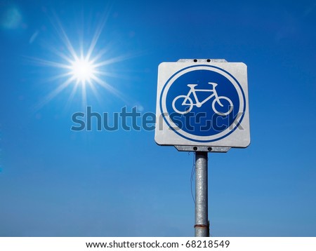 White and Blue Bicycle Traffic Sign and sky