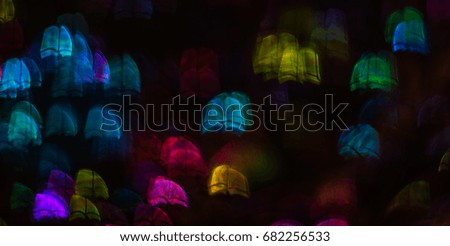 Beautiful background with different colored book , abstract background, book  shapes on black background, blurry