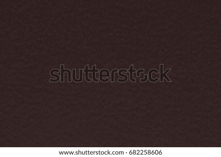 Texture of dark brown paper as a background. High resolution photo.