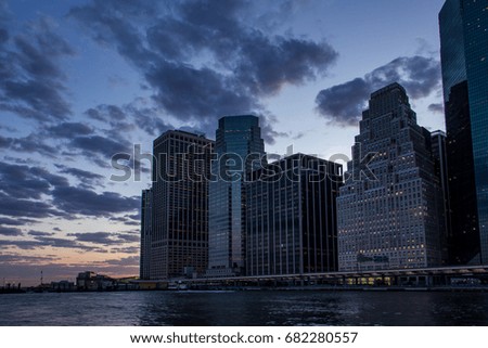East river sunset view of Lower Manhattan Skyline, New York United States