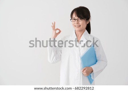 Women in white lab coat, doctor, pharmacist, ok
