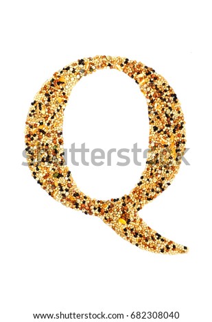 Alphabet "Q" made by putting grain on isolate white background. A beautiful capital letter "Q" made from cereal of birds food.
