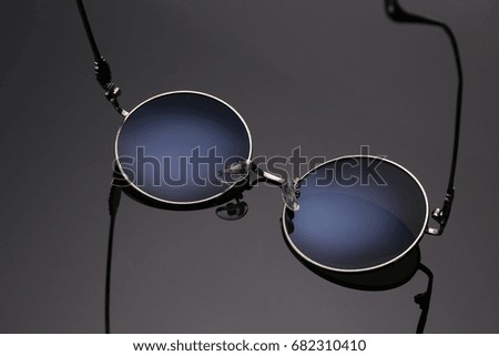 blue sunglasses in white background