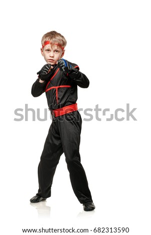 Young martial arts fighter practicing combat sport. Cosplay hero ninja