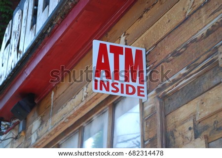 Store Entrance Sign - ATM Inside - Wooden Building, Red Letters - Money, Cash, Banks - Front Of Shop