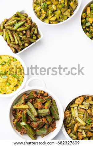 Group of Tawa fry sabzi or sabji like cauliflower/Phool Gobhi, bhindi OR okra, Gwar OR Cluster Beans, French Beans, Cabbage or Patta Gobi, Flat Green Beans, served in a bowl. selective focus