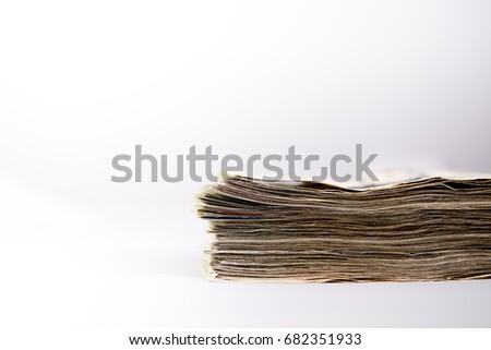 Side view of a stack of bank notes and white background