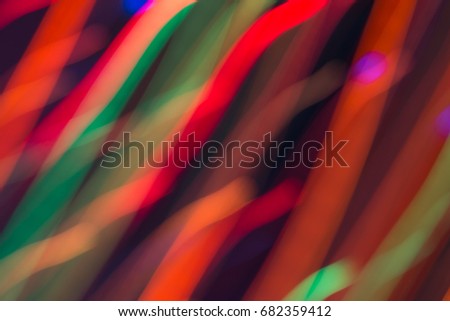 Abstract picture of bright colored dynamic lights on a dark background
