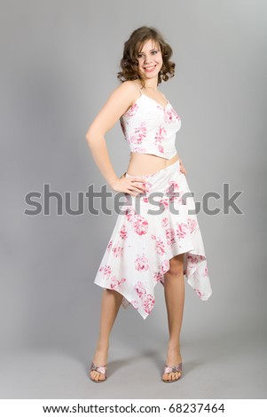 beautiful dancing girl on a gray background