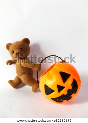 Teddy bear and pumpkin halloween isoloted on white background.