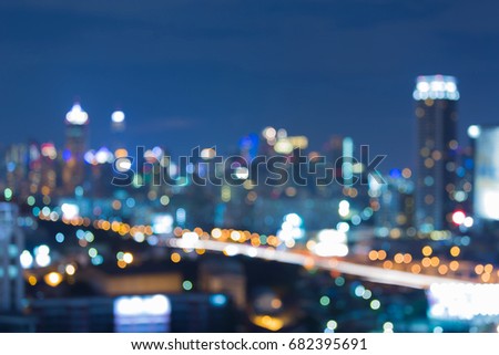 Night city light blurred bokeh at twilight, abstract background