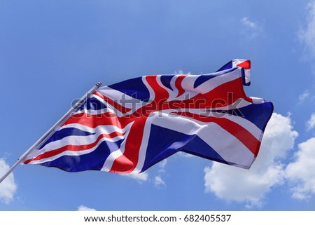 English flag with blue sky.