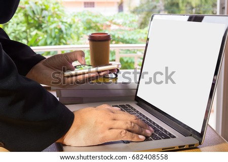 Hands using laptop for Online shopping or internet banking concept.Business man with notebook computer accessory on financial statistic data Stock market.