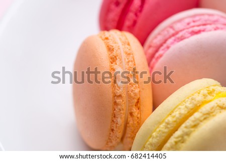 Closeup of colorful pastel macaroons. Sweet macarons.
