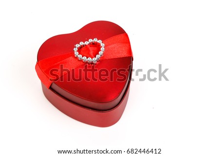 Red heart-shaped iron box