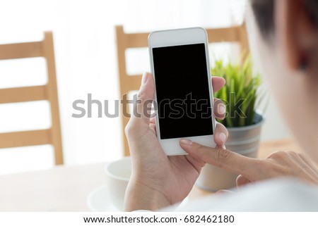Shopping online smartphone in hand with cafe.