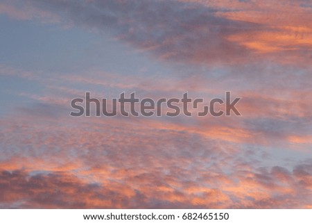 Beautiful sun set with red clouds over the sky with orange colour background 